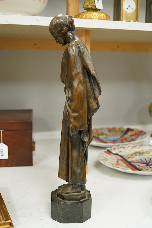 An early 20th century bronze figure of a classical maiden holding a laurel wreath, 46cm high. Condition - good